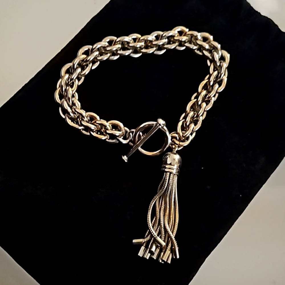 Gold tone metal with TASSEL CHARM WRAP Chain Bracelet.